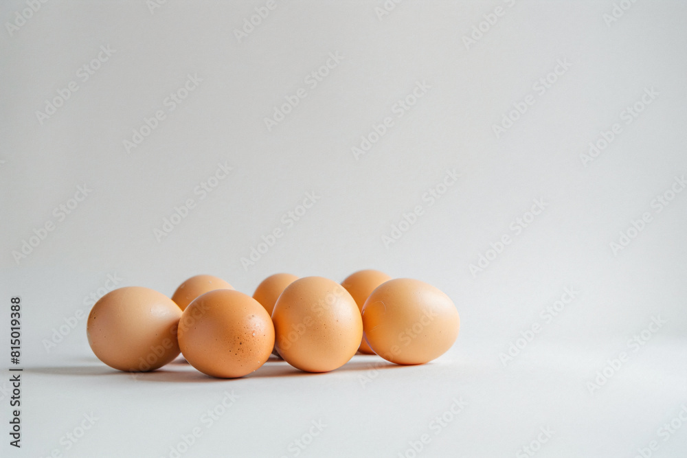 a group of eggs sitting on top of a white surface a group of eggs sitting on top of a white surface