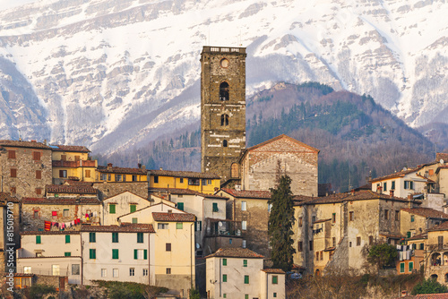 Coreglia Antelminelli village and snowy mountains in the background. Garfagnana, Tuscany, Italy. photo