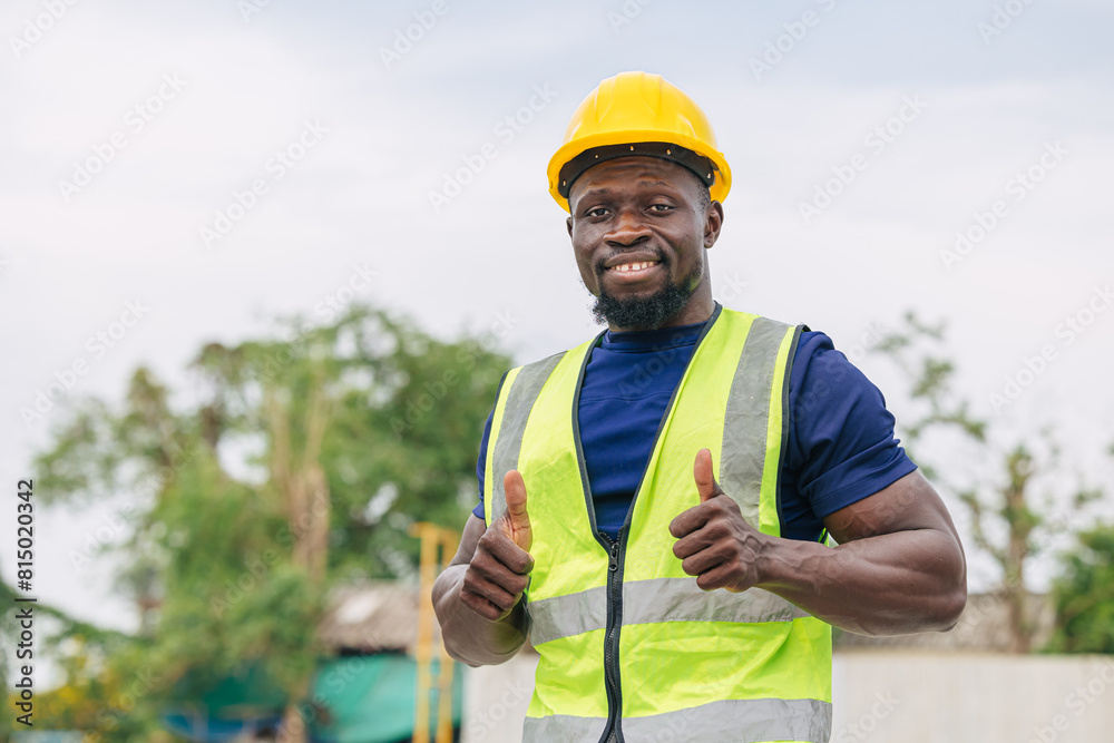 Portrait happy smiling African black smart engineer worker foreman supervisor working outdoor Thumbs up Portrait happy smiling African black smart engineer worker foreman supervisor working outdoor Thumbs up
