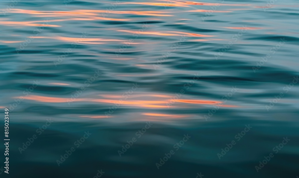 Closeup view on water surface with sunset light on it Closeup view on water surface with sunset light on it