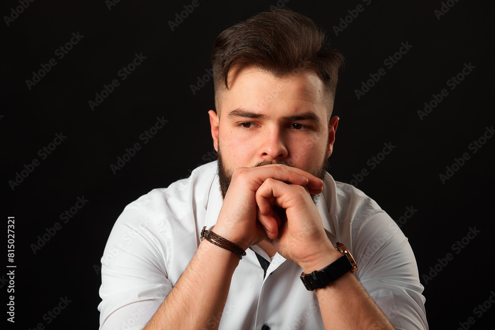 Close-up portrait of a man with a beard in a white shirt. Grain effect used Close-up portrait of a man with a beard in a white shirt. Grain effect used