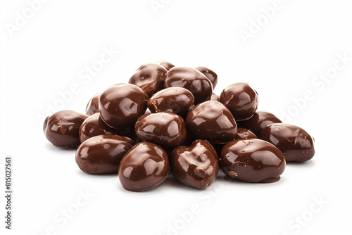 a pile of chocolate covered nuts on a white surface