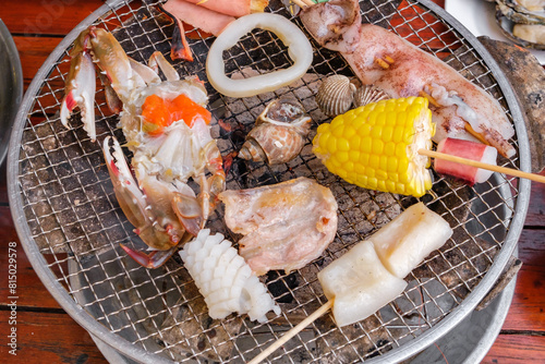 Seafood BBQ at asian charcoal brazier © elenvd