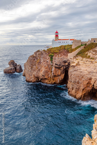 lighthouse on the high cliffs of Cape St. Vincent. The most southwestern point of mainland Europe. natural landscape of the Atlantic Ocean, rocky coast at Cabo de Sao Vicente in the Algarve, Portugal photo
