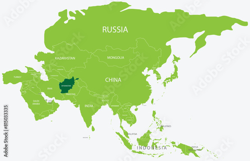 Highlighted green map of AFGHANISTAN inside light green political map of Asia using orthographic projection on light blue background
