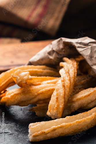 close-up of hot crocane flour churros fried in oil