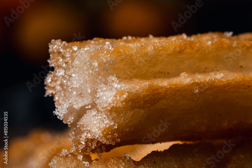 close-up of hot crocane flour churros fried in oil