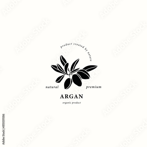 Flat vector argan nut with leaves logo