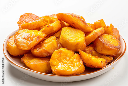 a bowl of cooked potatoes on a white table