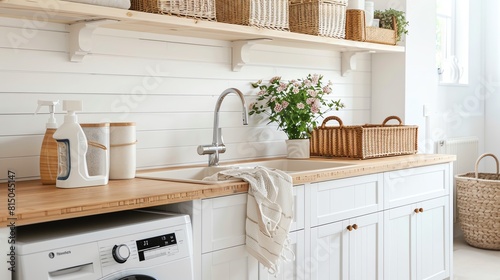 A Scandinavian laundry room with white cabinets, wooden countertops, and wicker baskets for storage