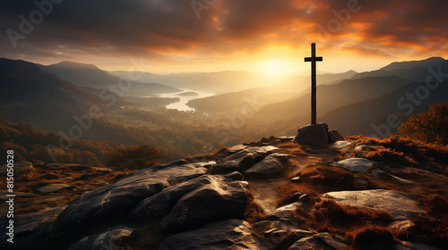 Silhouettes of crucifix symbol on top mountain with bright sunbeam on the colorful sky background