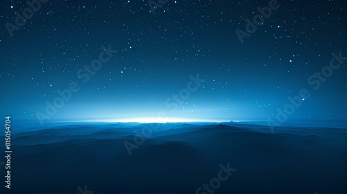 The dark blue sky is filled with stars. photo