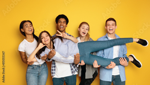 Photos A diverse group of teenagers is seen gathering together and striking various pos