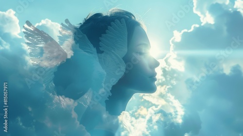 A woman in a white dress is wearing wings and is looking up at the sky