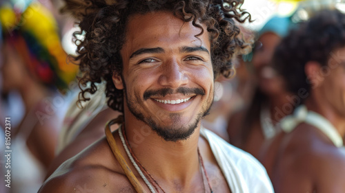 Happy young man with curly hair smiling