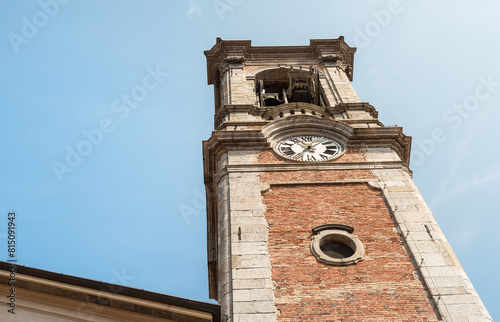 Bell rower of the Santo Stefano Protomartire church in the center of ancient village Appiano Gentile, province of Como, Lombardy, Italy photo