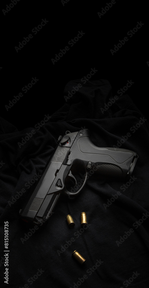 Modern semi-automatic pistol on a dark back. Armament for the army and police. Short-barreled weapon. Modern semi-automatic pistol on a dark back. Armament for the army and police. Short-barreled weapon.