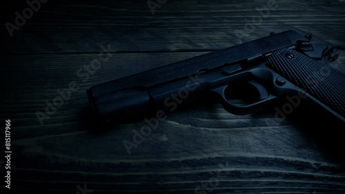 Gun On Table In Dark Room
 photo