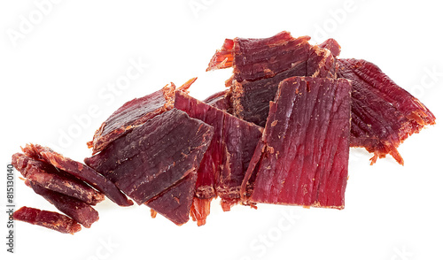 Pieces of delicious beef jerky isolated on a white background. Portion of dried meat.