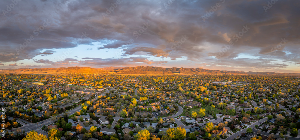 Fototapeta premium early morning with clouds over Fort Collins and foothills of Rocky Mountains in northern Colorado, springtime aerial view