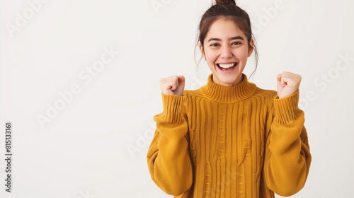 a smiling happy woman with fists clenched