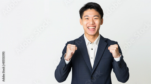 a smiling happy professional Asian Chinese Korean Japanese man with fists clenched