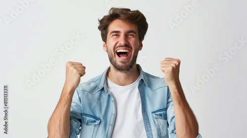 a smiling happy fashion man with fists clenched