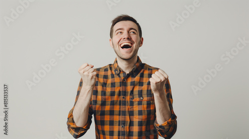 a smiling happy man with fists clenched
