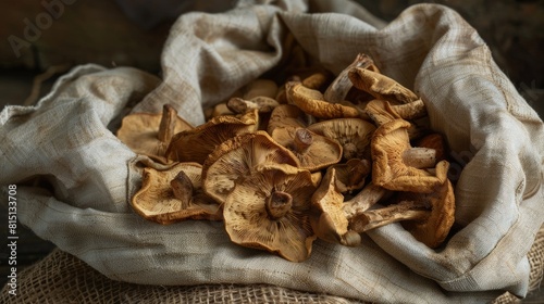  Dried porcini mushrooms, earthy and aromatic, in a linen bag.