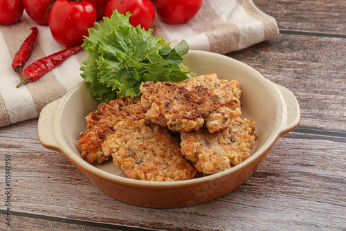 Fried salmonn cutlet in the bowl photo