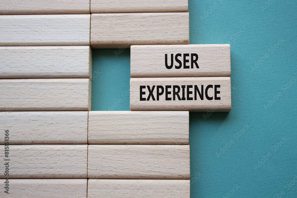 User Experience symbol. Concept word User Experience on wooden blocks. Beautiful grey green background. Business and User Experience concept. Copy space User Experience symbol. Concept word User Experience on wooden blocks. Beautiful grey green background. Business and User Experience concept. Copy space