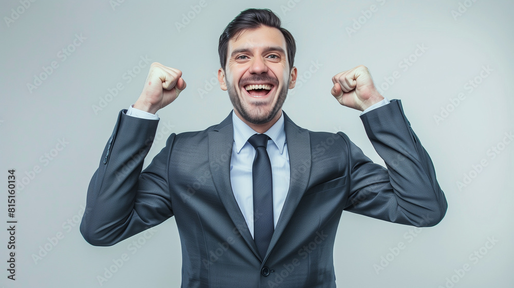 a smiling happy business man with fists clenched success a smiling happy business man with fists clenched success