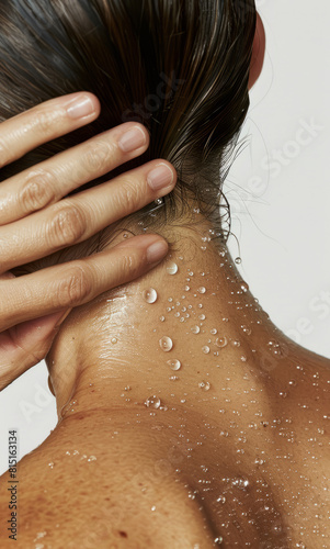 Close-Up of Woman's Neck and Shoulder Adorned with Water Droplets