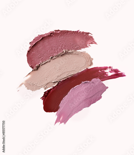 Smeared lipsticks palette in muted pastel colors.