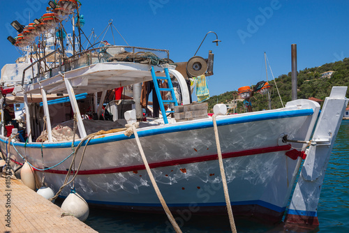 Vathy town, Meganisi island, Ionian Sea, GREECE-JULY 30, 2023: Fishing boat in Vathy Harbor.