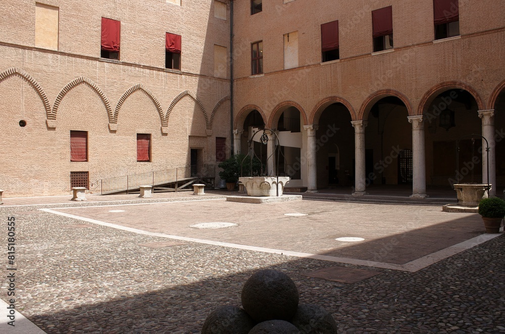 Fototapeta premium The courtyard of the Estense Castle, (Castello di San Michele), is the most representative monument of the city of Ferrara (Italy), declared a world heritage site by UNESCO