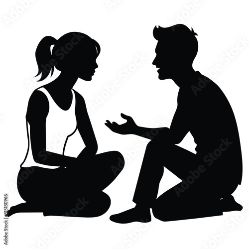 A girlfriend and boyfriend talking to each other while sitting on the ground