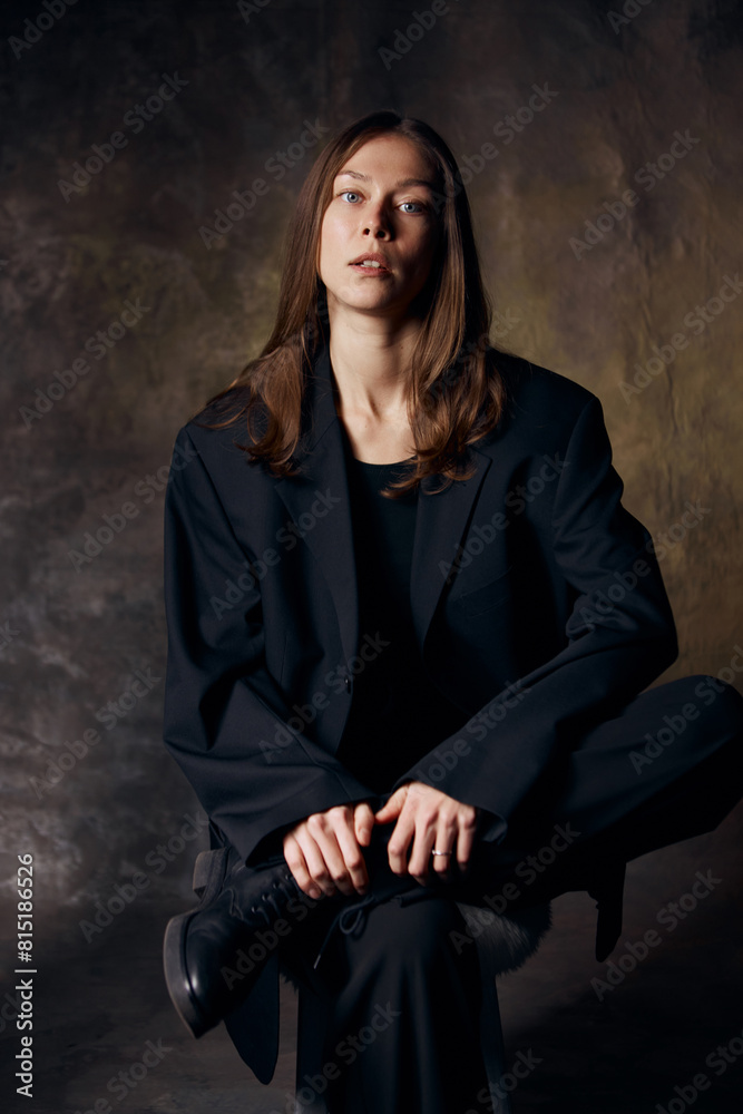 Beautiful girl in jacket on canvas background without makeup Beautiful girl in jacket on canvas background without makeup