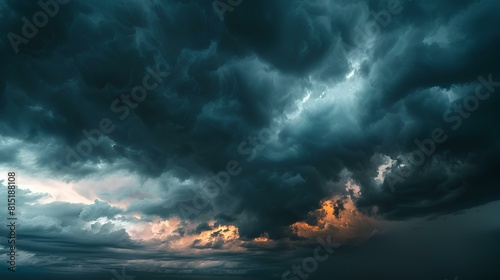 A dark stormy sky with clouds building up for a big storm. photo