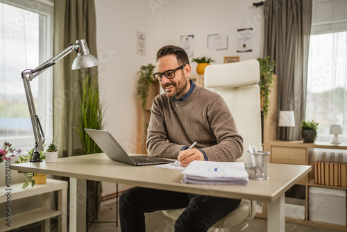 Adult man sit at office have video consultation prepare to sign paper