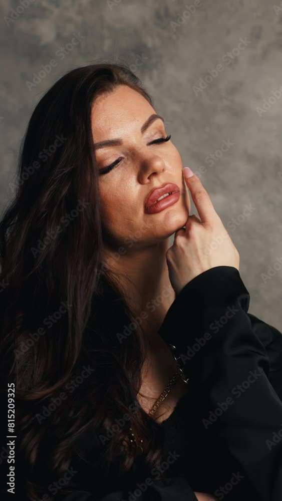 Lingerie Chic: Woman Standing in Front of Wall in Black Jacket Lingerie Chic: Woman Standing in Front of Wall in Black Jacket
