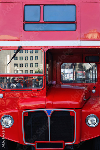 Classic Red Double-Decker Bus in Urban Environment