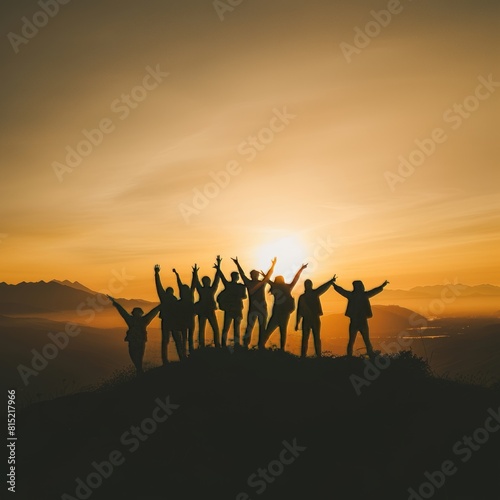 Silhouette of group happy business team making high hands over head in beautiful sunset sky evening time for business success and teamwork concept in company. International Friendship Day.