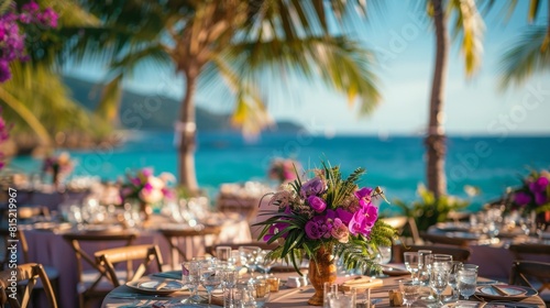 tropical wedding decor, at the beach wedding reception, elegant palm leaf and orchid centerpieces added a romantic touch to the tables, enhancing the tropical ambiance photo