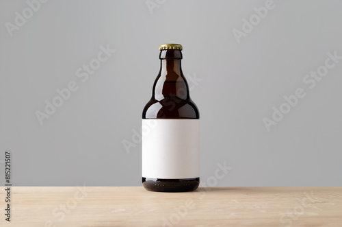 Amber steinie beer bottle mockup with blank label on a wooden table. photo