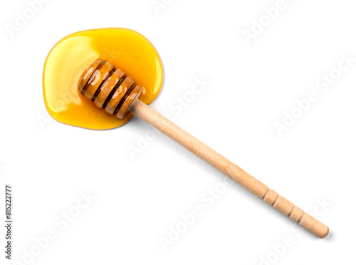 Honey with wooden honey dipper isolated on white background. Spilled honey. Honey Spoon, drizzler, stick. Top view. Flat lay. 