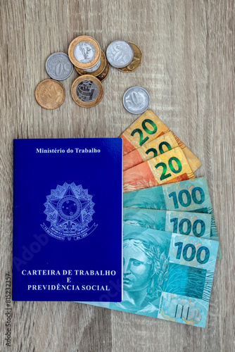 Brazilian work card. Registered work CLT and money from Brazil. Minimum wage Brazilian real money. photo
