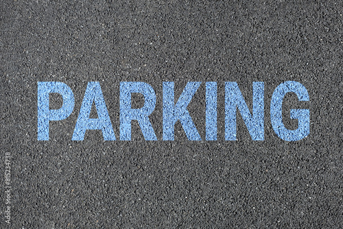 Parking sign on road. drawn with color paint on asphalt.