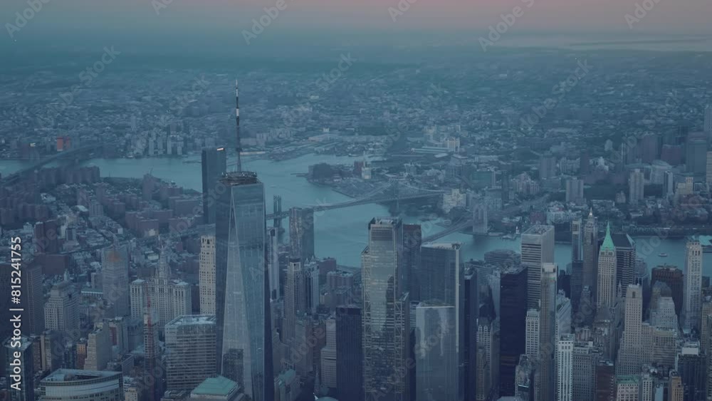 Aerial shot of New York from the sky. The view of Downtown and Lower Manhattan from a helictoper. Dark blue evening light. Aerial shot of New York from the sky. The view of Downtown and Lower Manhattan from a helictoper. Dark blue evening light.