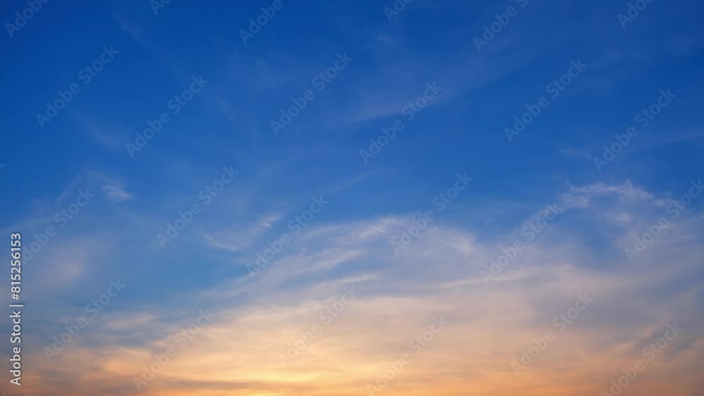 Vibrant hues dance across the evening canvas in this mesmerizing time-lapse, as the sun bids farewell to the day in a symphony of color. Cloud background. Sunset timelapse. 4K.
